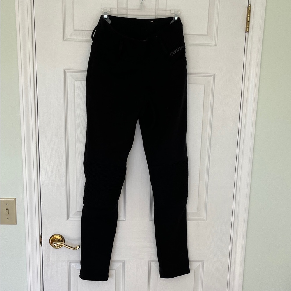 Black Alpinestars brand Banshee women’s motorcycle leggings with padded knees.